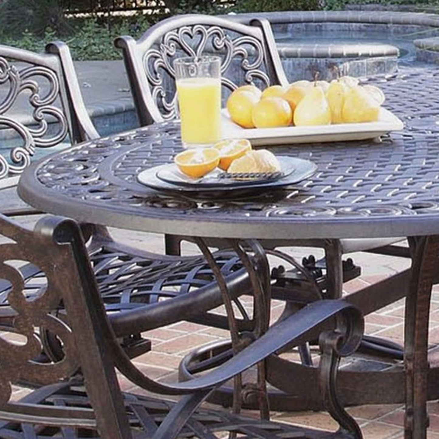 Sanibel Cast Aluminum 7-Piece Outdoor Dining Set with an Oval Table and 6 Swivel Chairs by Homestyles