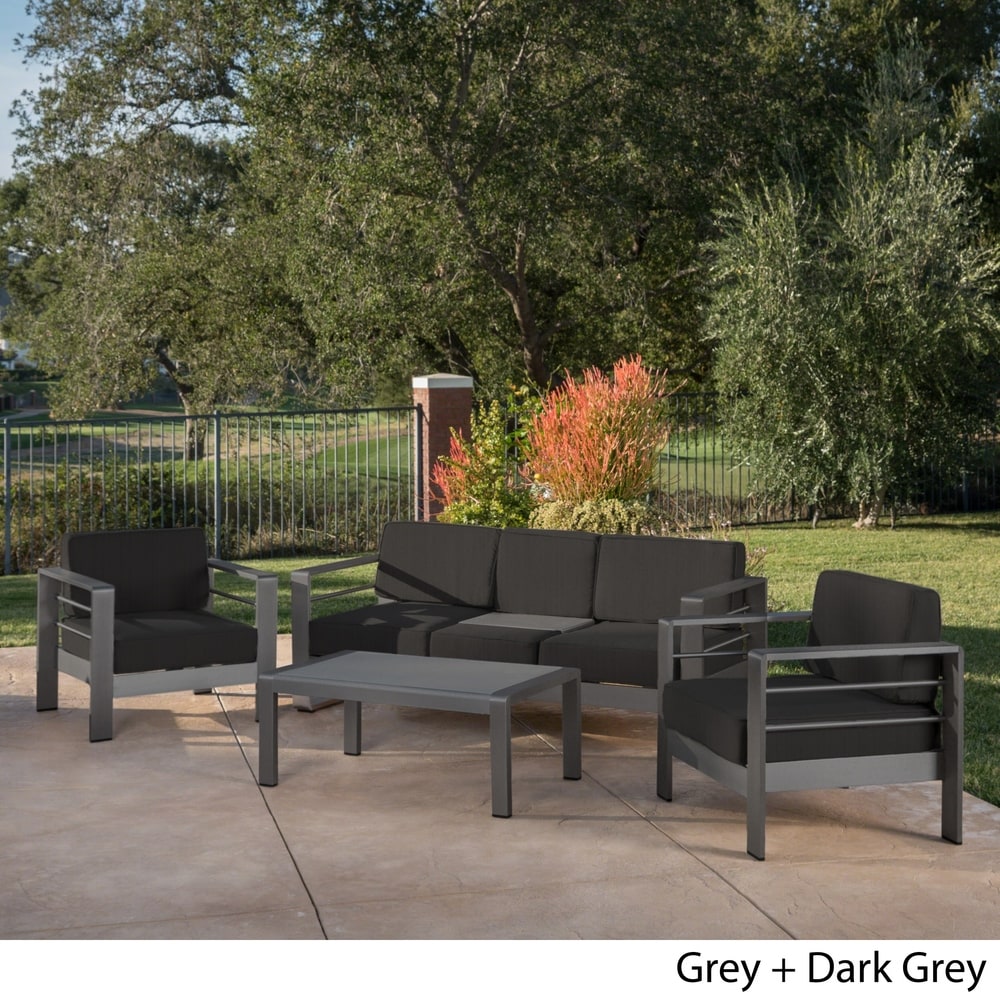 Cape Coral Outdoor Aluminum Tempered Glass 4-piece Sofa Chat Set with Cushions by Christopher Knight Home